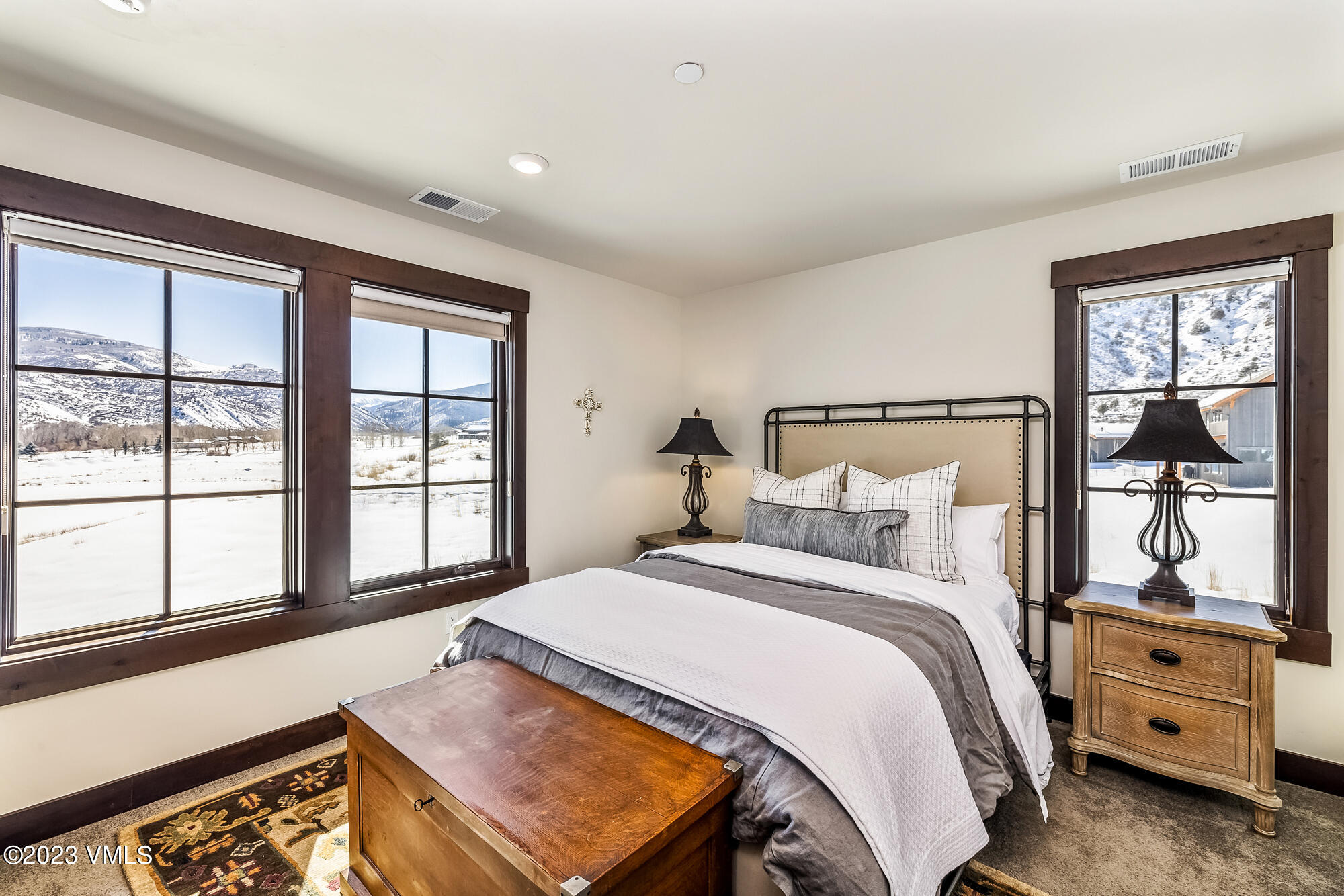 434 Hunters View Lane Eagle, CO 81631 - Photo 19 of 28 a bedroom with a bed and a large window
