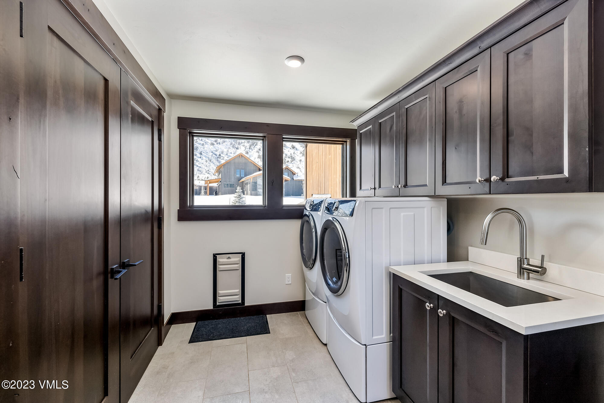434 Hunters View Lane Eagle, CO 81631 - Photo 27 of 28 a kitchen with a refrigerator and a sink