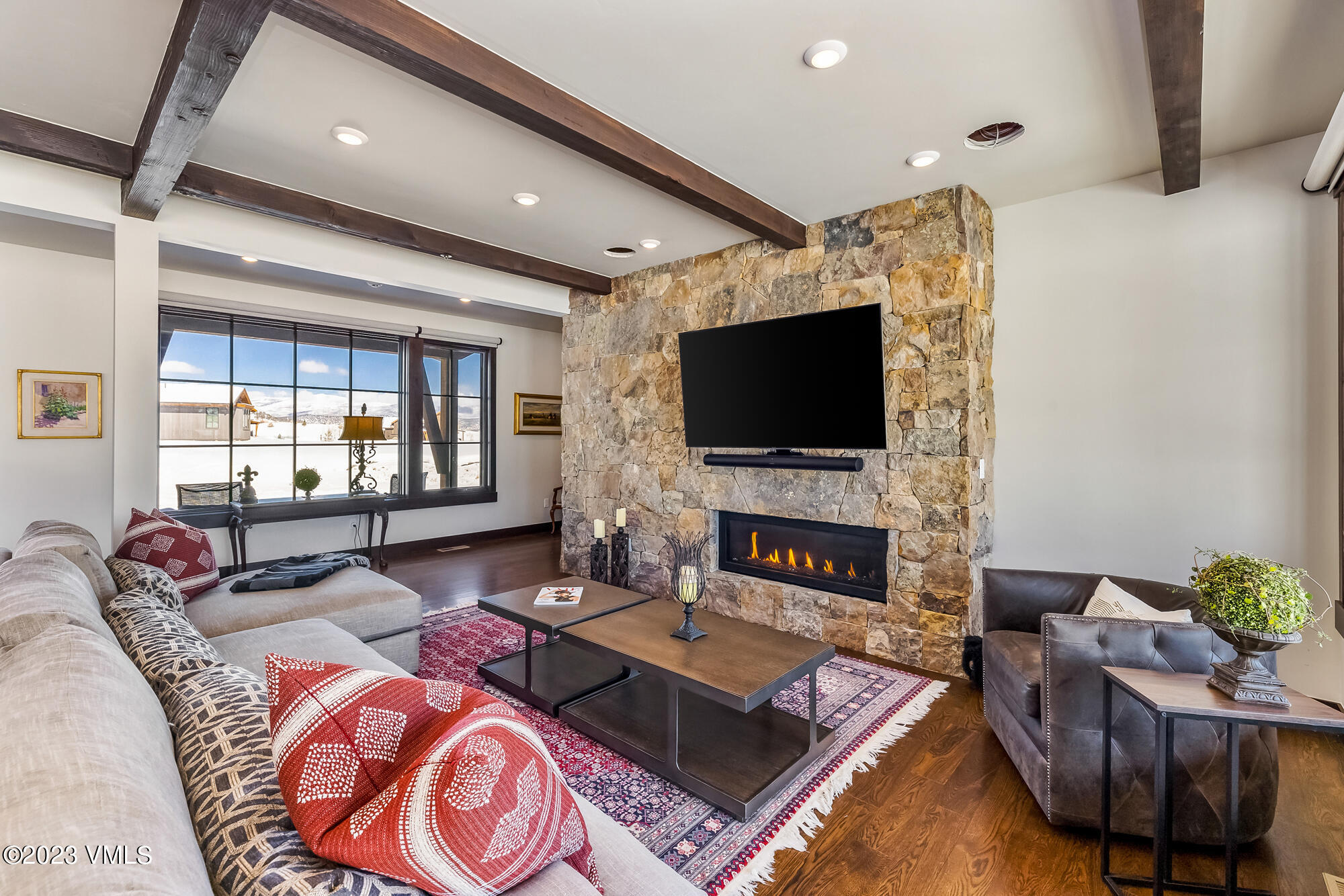 434 Hunters View Lane Eagle, CO 81631 - Photo 10 of 28 a living room with fireplace furniture and a flat screen tv