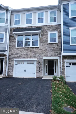 a view of a building with a yard