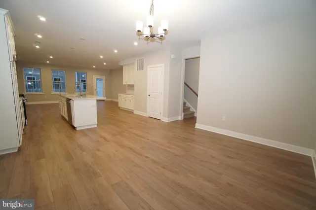 a view of a kitchen with workspace and a window