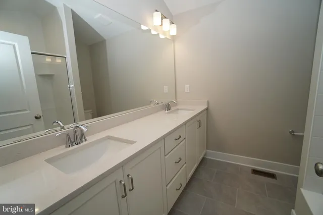 a bathroom with a bathtub and shower