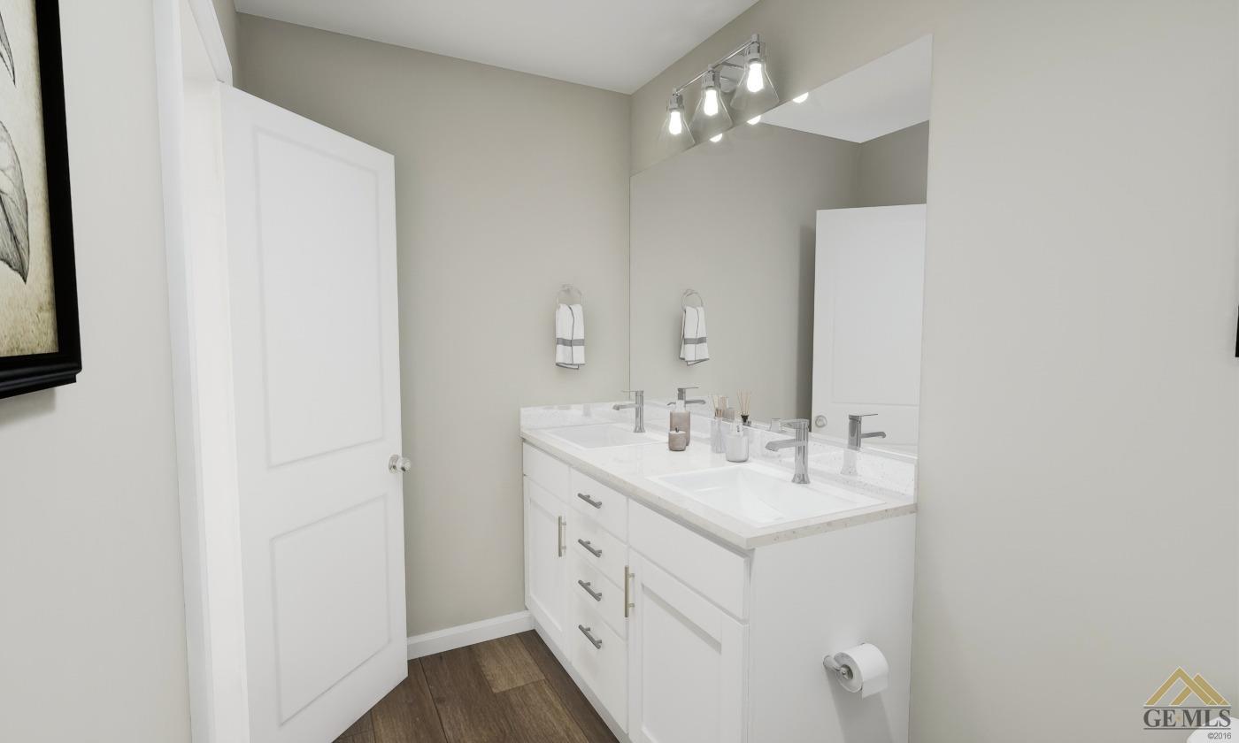 Undisclosed Address Bakersfield, CA 93313 - Photo 13 of 20 a bathroom with a sink vanity and a mirror