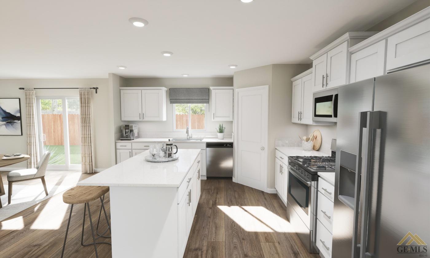 Undisclosed Address Bakersfield, CA 93313 - Photo 6 of 20 a kitchen with stainless steel appliances a refrigerator a sink a stove a table and chairs
