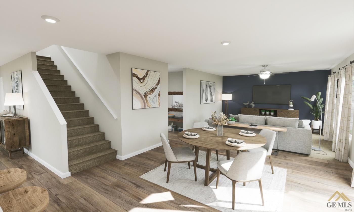 Undisclosed Address Bakersfield, CA 93313 - Photo 7 of 20 a view of a dining room with furniture and wooden floor