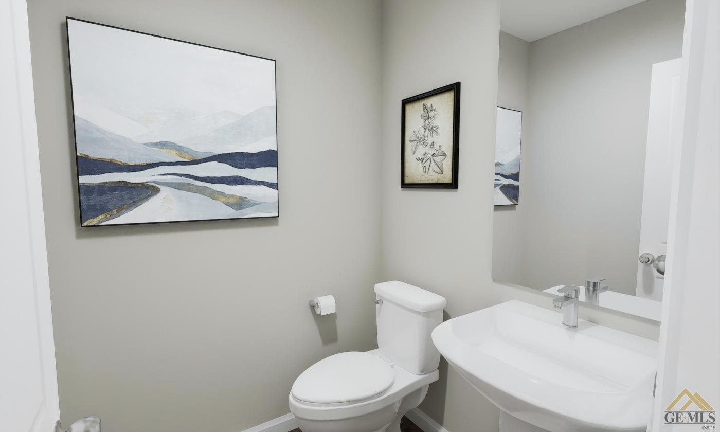 Undisclosed Address Bakersfield, CA 93313 - Photo 9 of 20 a bathroom with a toilet sink and mirror