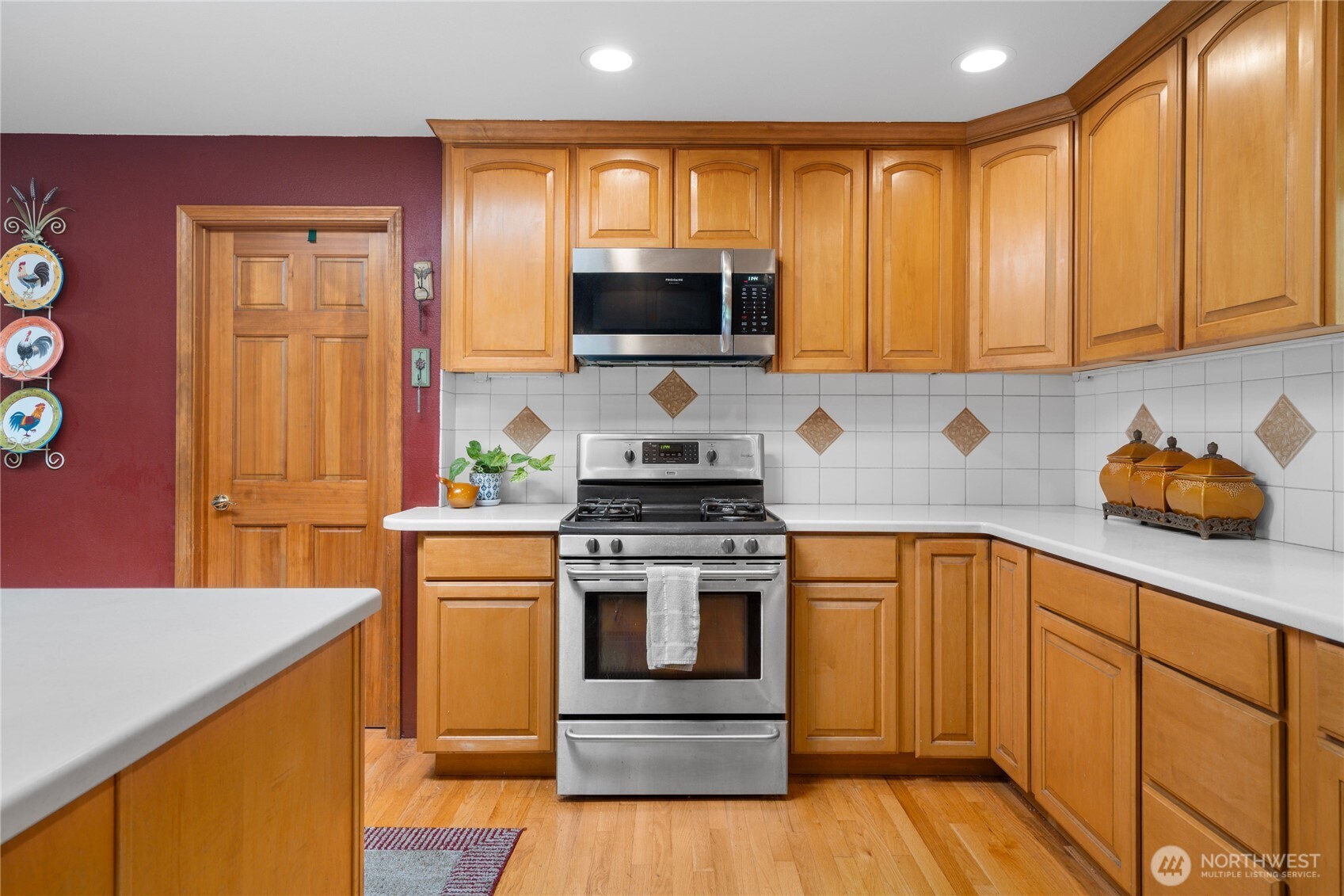 3915 Silvana Terrace Road Stanwood, WA 98292 - Photo 14 of 40 a kitchen with wooden cabinets and a stove top oven