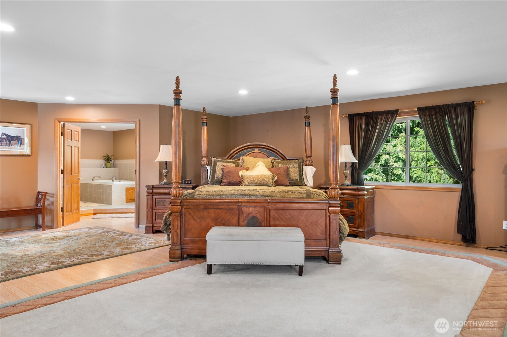 3915 Silvana Terrace Road Stanwood, WA 98292 - Photo 23 of 40 a bedroom with a bed and large window