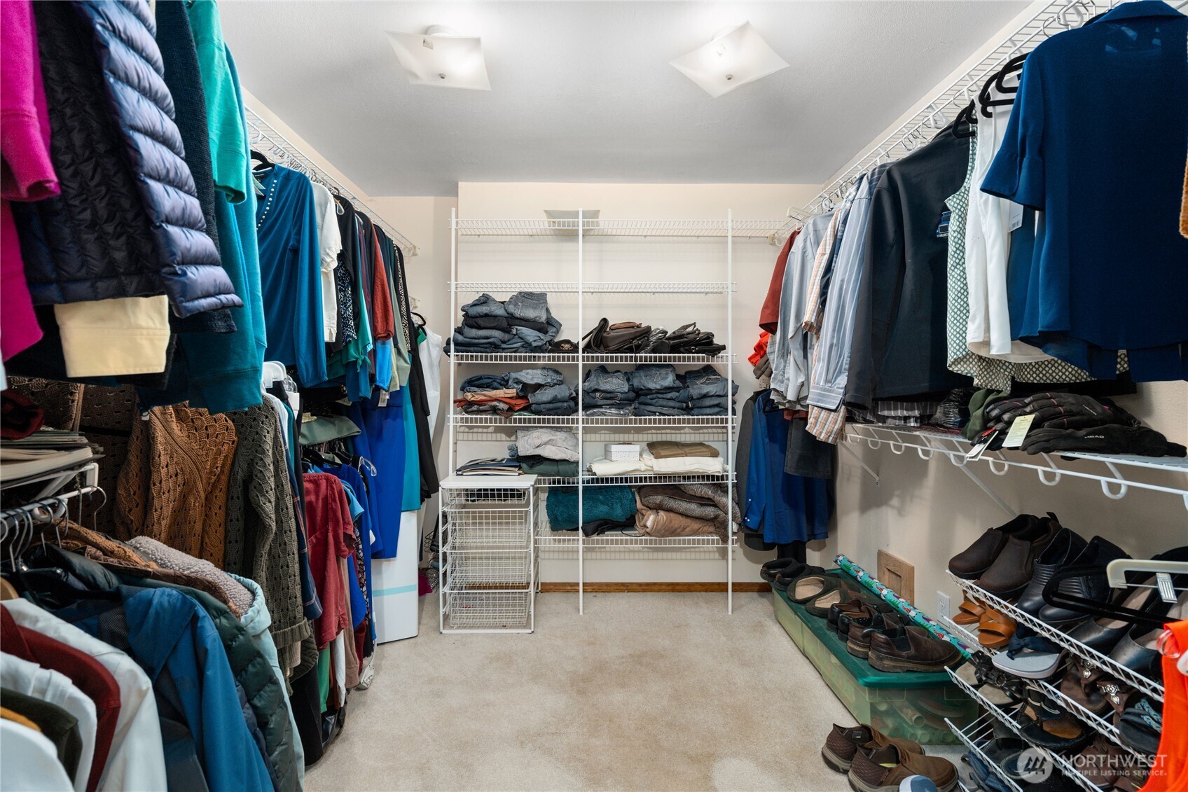 3915 Silvana Terrace Road Stanwood, WA 98292 - Photo 24 of 40 a view of walk in closet with clothes and shoes
