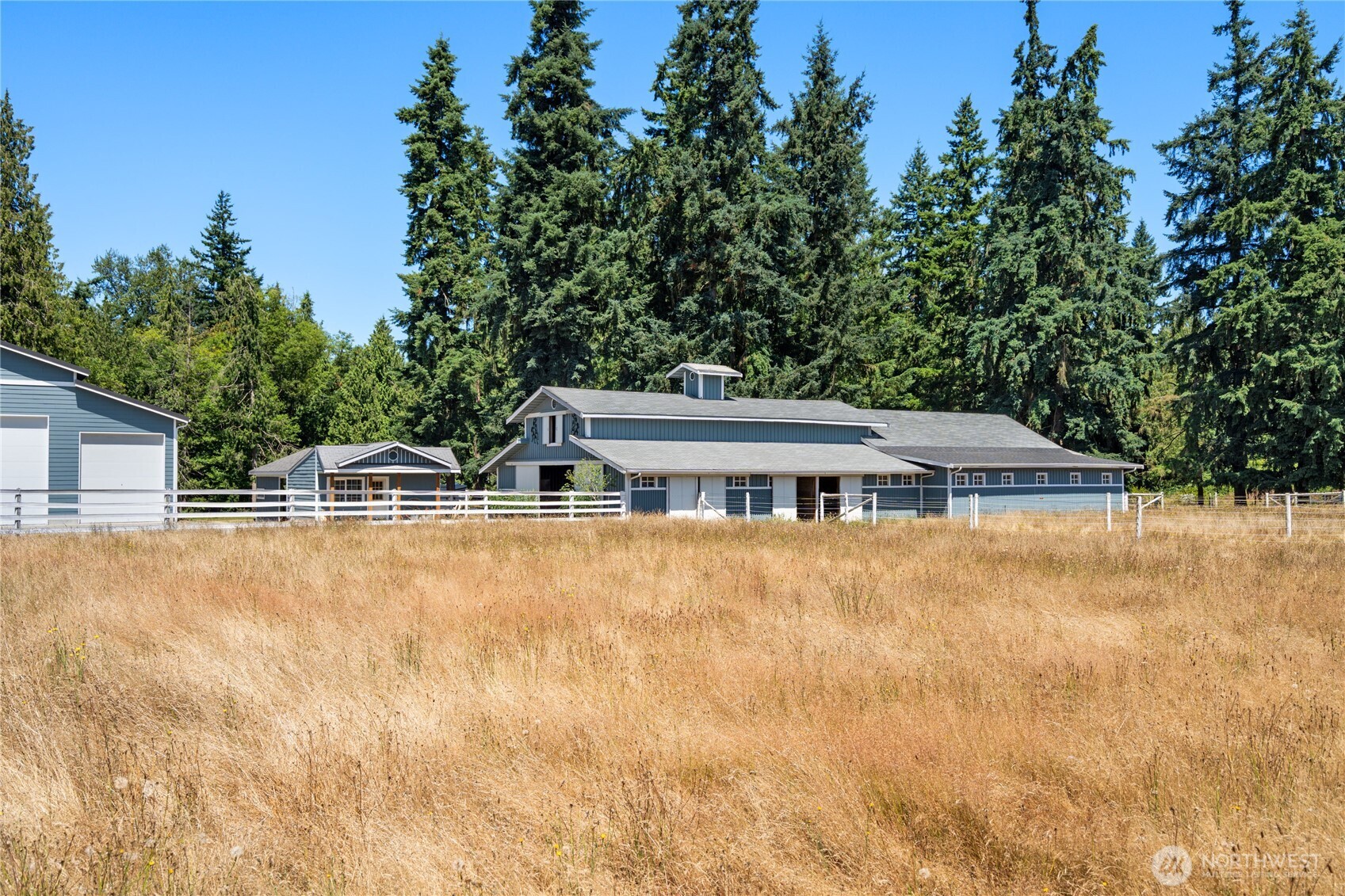 3915 Silvana Terrace Road Stanwood, WA 98292 - Photo 37 of 40 a front view of house with yard and trees in the background
