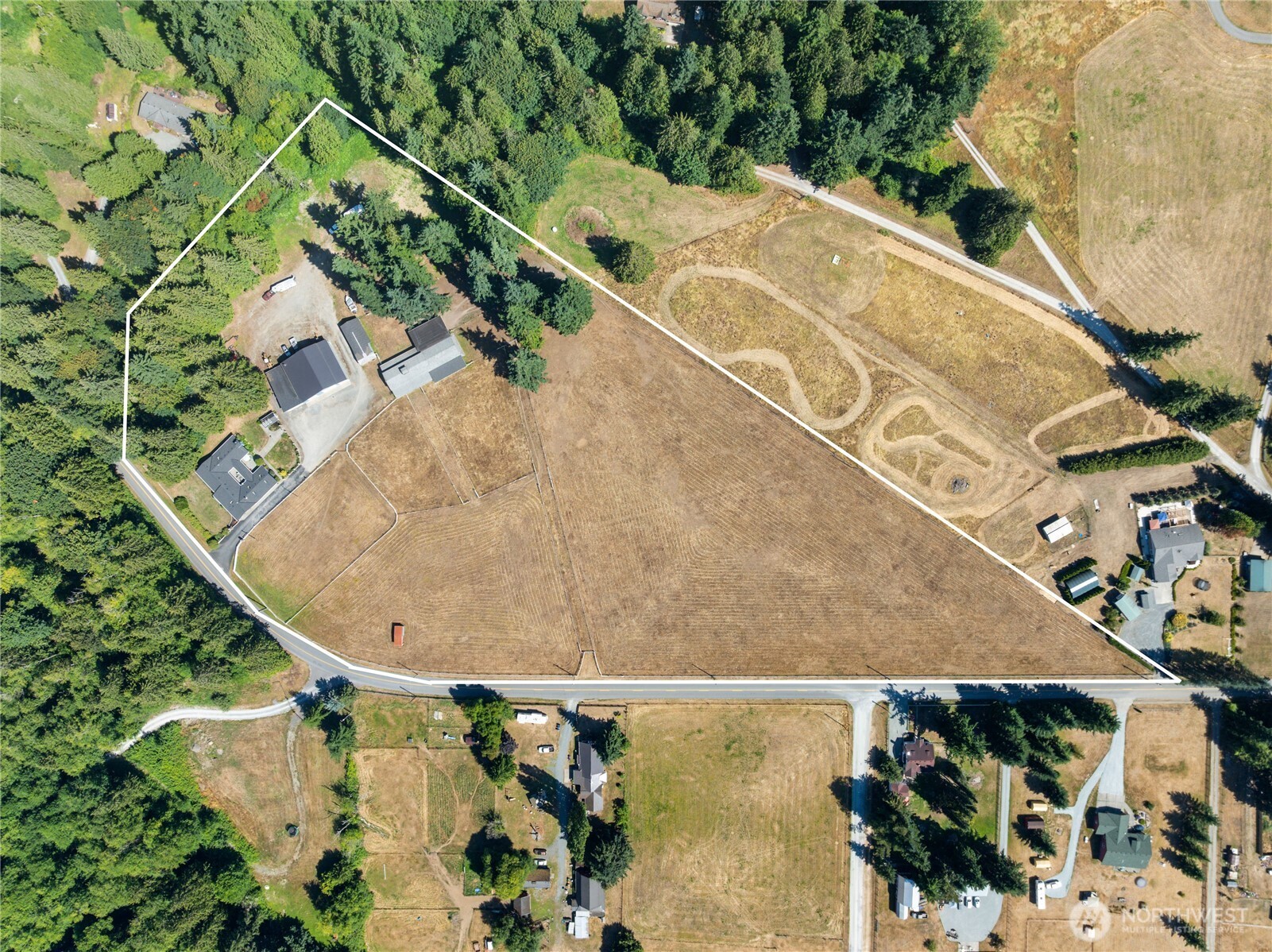 3915 Silvana Terrace Road Stanwood, WA 98292 - Photo 39 of 40 an aerial view of a house with a yard and a fountain