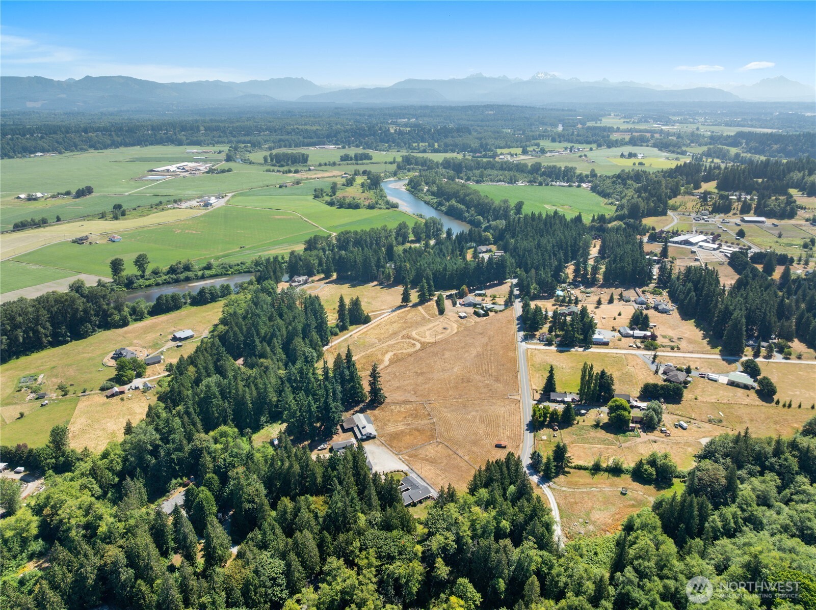 3915 Silvana Terrace Road Stanwood, WA 98292 - Photo 40 of 40 an aerial view of residential houses with outdoor space and river