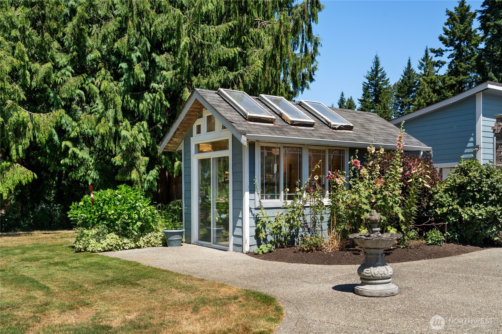 3915 Silvana Terrace Road Stanwood, WA 98292 - Photo 5 of 40 a front view of a house with a yard and potted plants