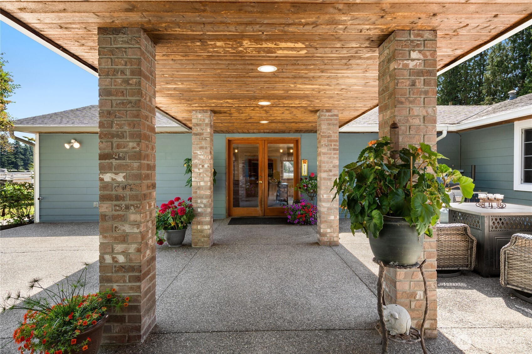 3915 Silvana Terrace Road Stanwood, WA 98292 - Photo 7 of 40 a potted plant sitting in front of a building