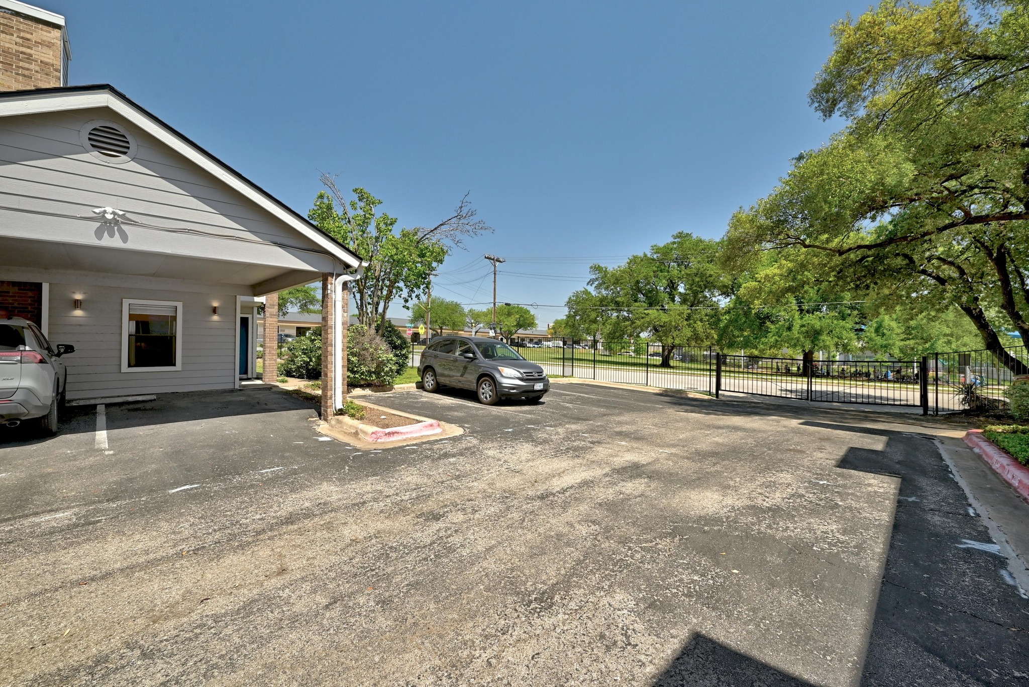 7635 Guadalupe Street, Unit 1002 Austin, TX 78752 - Photo 26 of 27 a view of road and parking