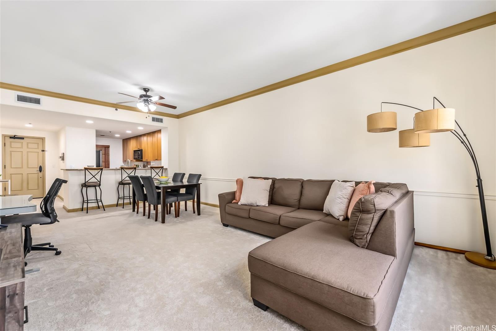 a living room with furniture and white walls