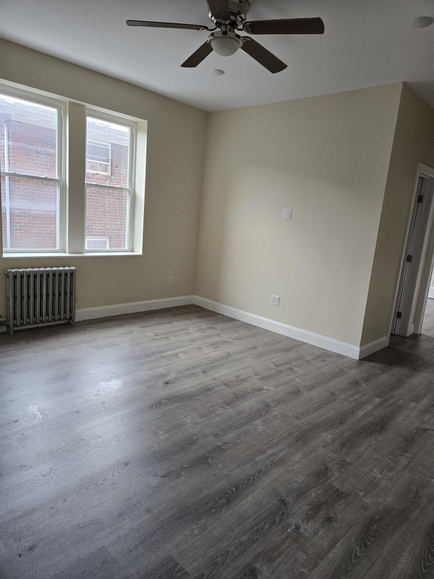289 Day Avenue, Unit B2 Fairview, NJ 07022 - Photo 2 of 6 a view of an empty room with a window
