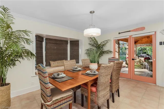 a kitchen with a refrigerator and a stove