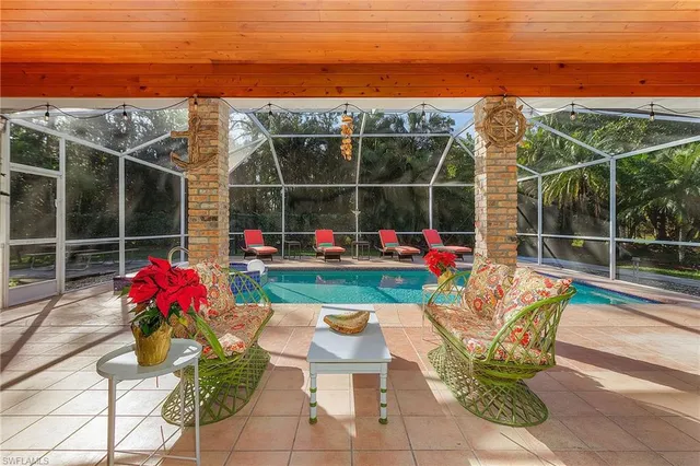 a view of a backyard with sitting area