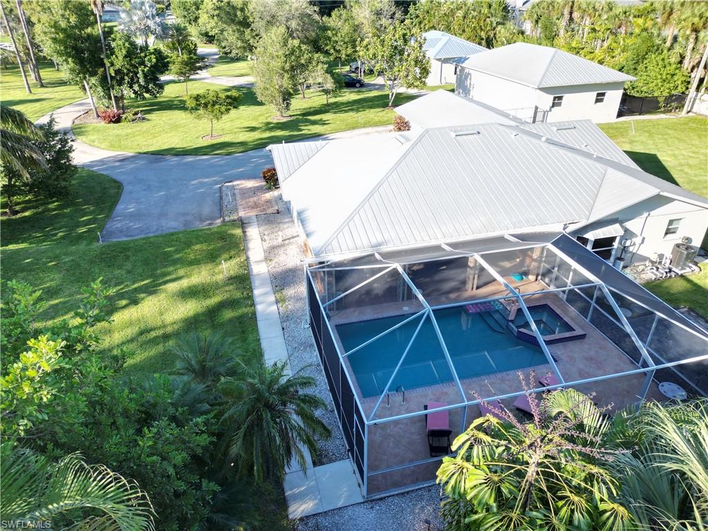 2950 Coach House Lane Naples, FL 34105 - Photo 33 of 50 an outdoor space with seating