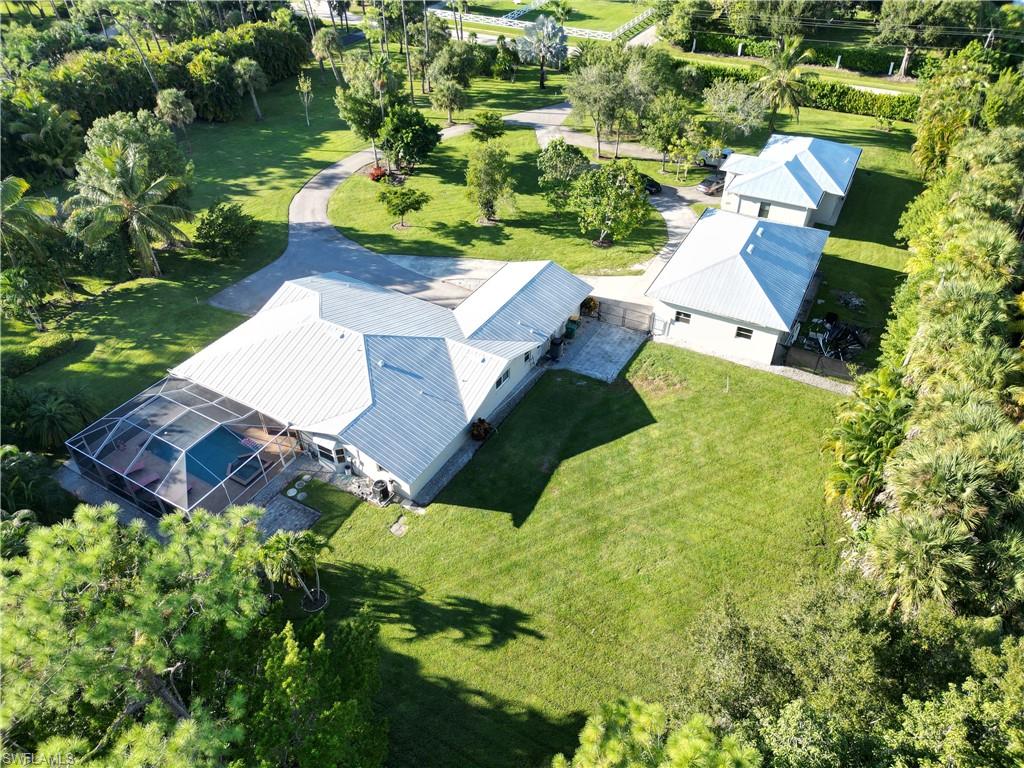 2950 Coach House Lane Naples, FL 34105 - Photo 35 of 50 an aerial view of residential house with outdoor space and swimming pool