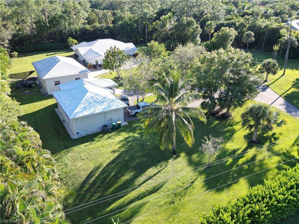 2950 Coach House Lane Naples, FL 34105 - Photo 36 of 50 a view of a garden with plants