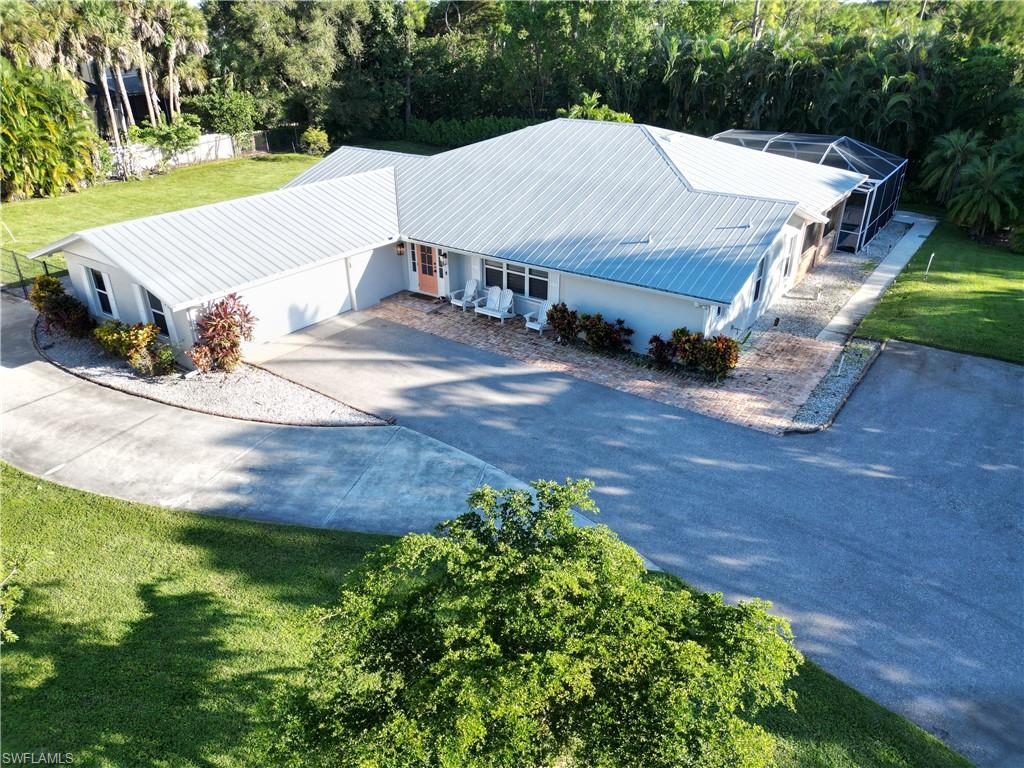 2950 Coach House Lane Naples, FL 34105 - Photo 39 of 50 a view of a house with a yard