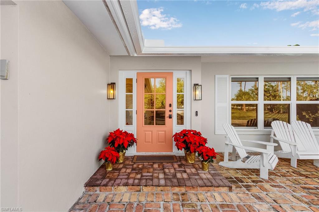 2950 Coach House Lane Naples, FL 34105 - Photo 6 of 50 a room with furniture and window