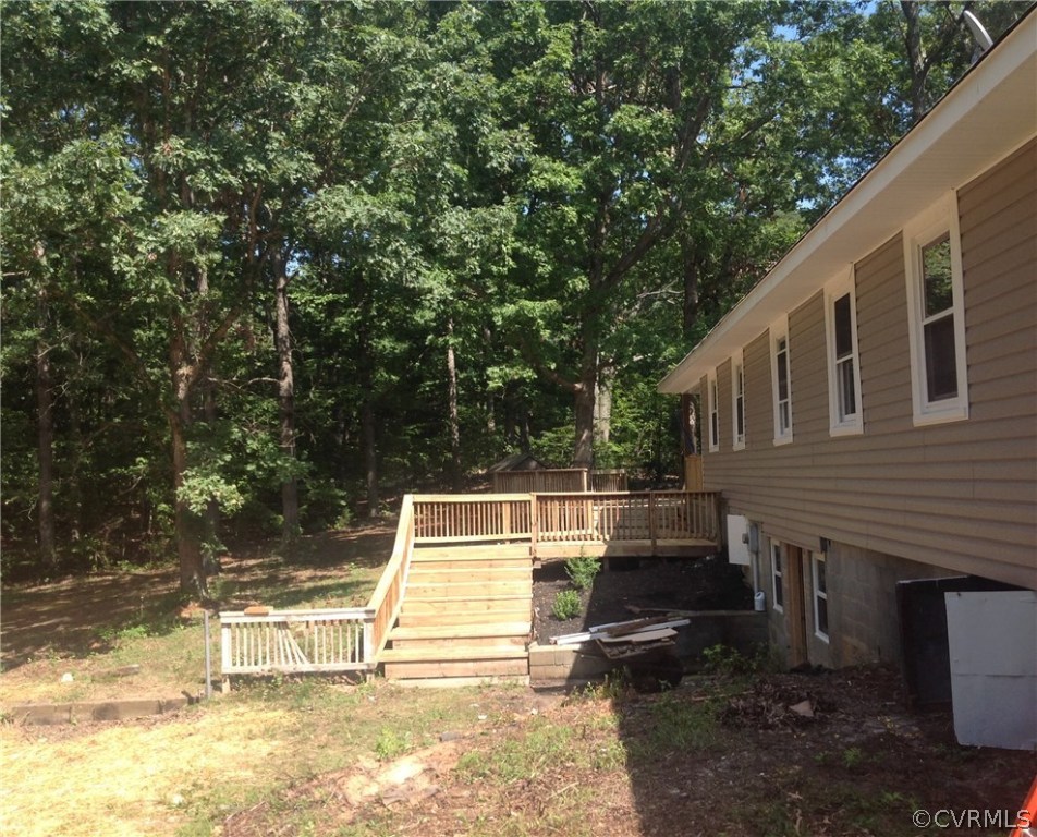 4563 New Line Road Gum Spring, VA 23065 - Photo 11 of 11 a view of house with backyard porch and entertaining space