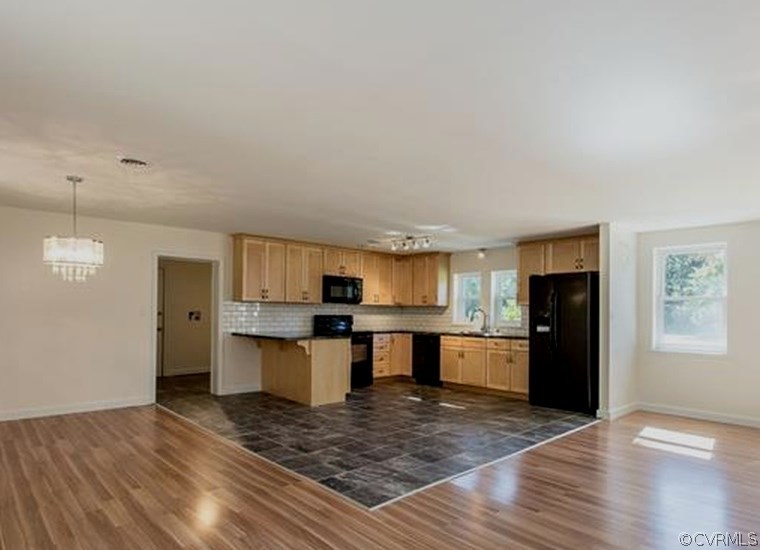 4563 New Line Road Gum Spring, VA 23065 - Photo 4 of 11 a kitchen with a refrigerator and a stove top oven