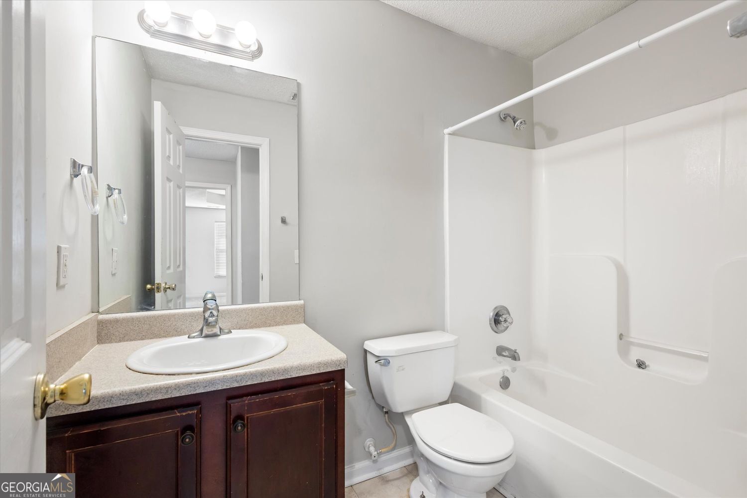 118 Covington Cove Byron, GA 31008 - Photo 14 of 21 a bathroom with a granite countertop sink toilet and shower
