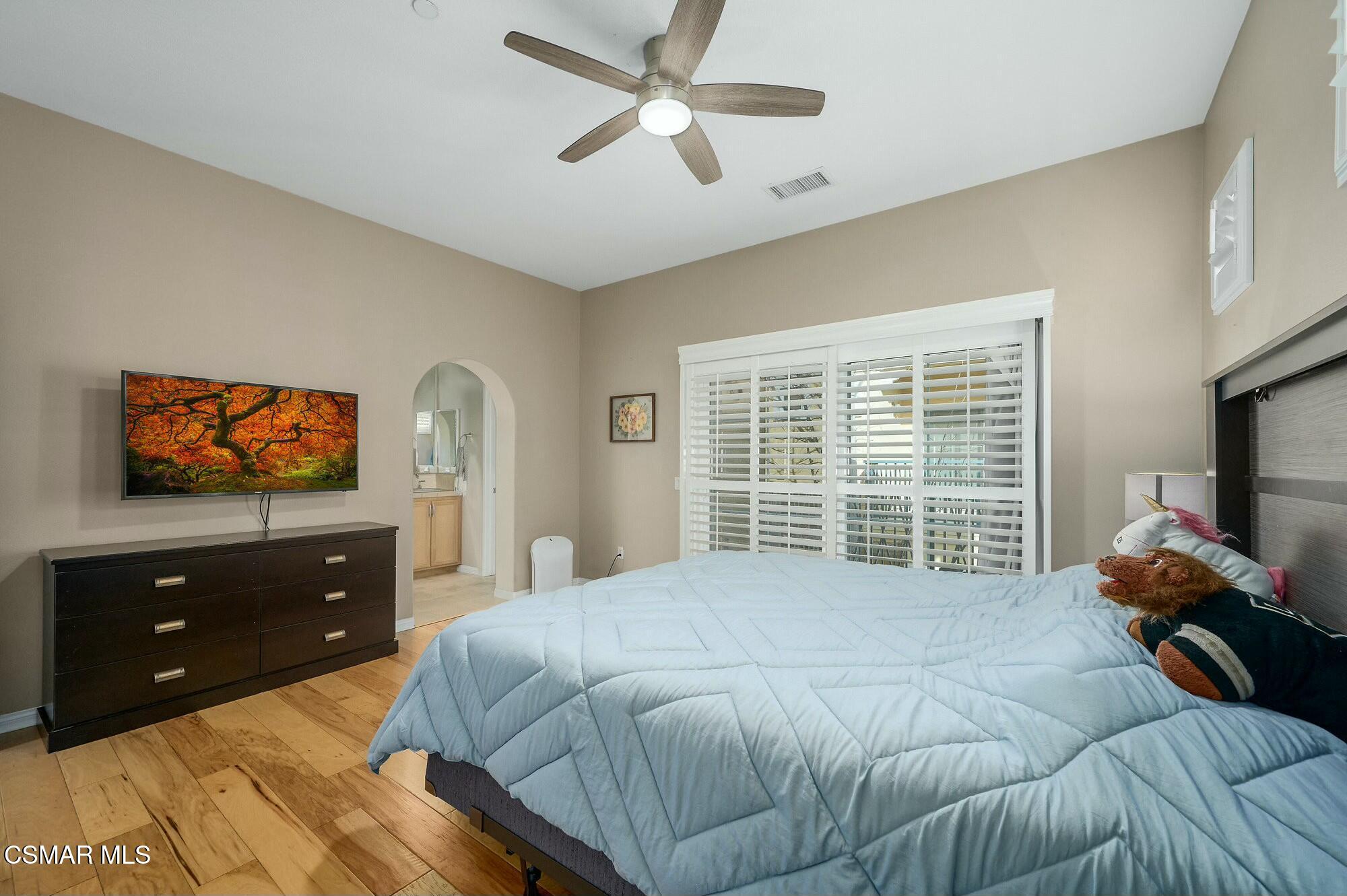 4121 Paredo Way, Unit D Simi Valley, CA 93063 - Photo 12 of 29 a bedroom with a bed and a flat screen tv