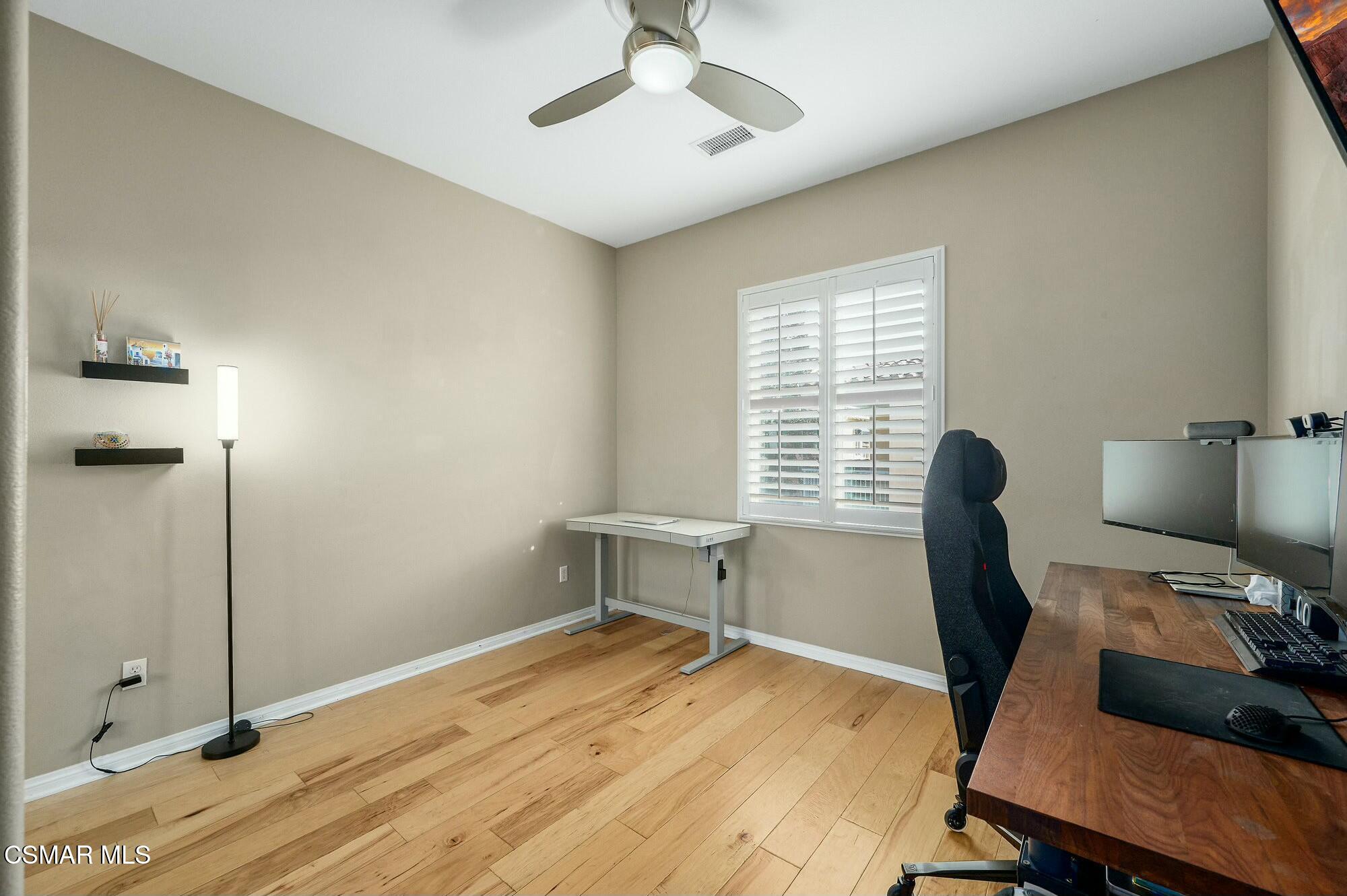 4121 Paredo Way, Unit D Simi Valley, CA 93063 - Photo 19 of 29 a view of a workspace with furniture and a window
