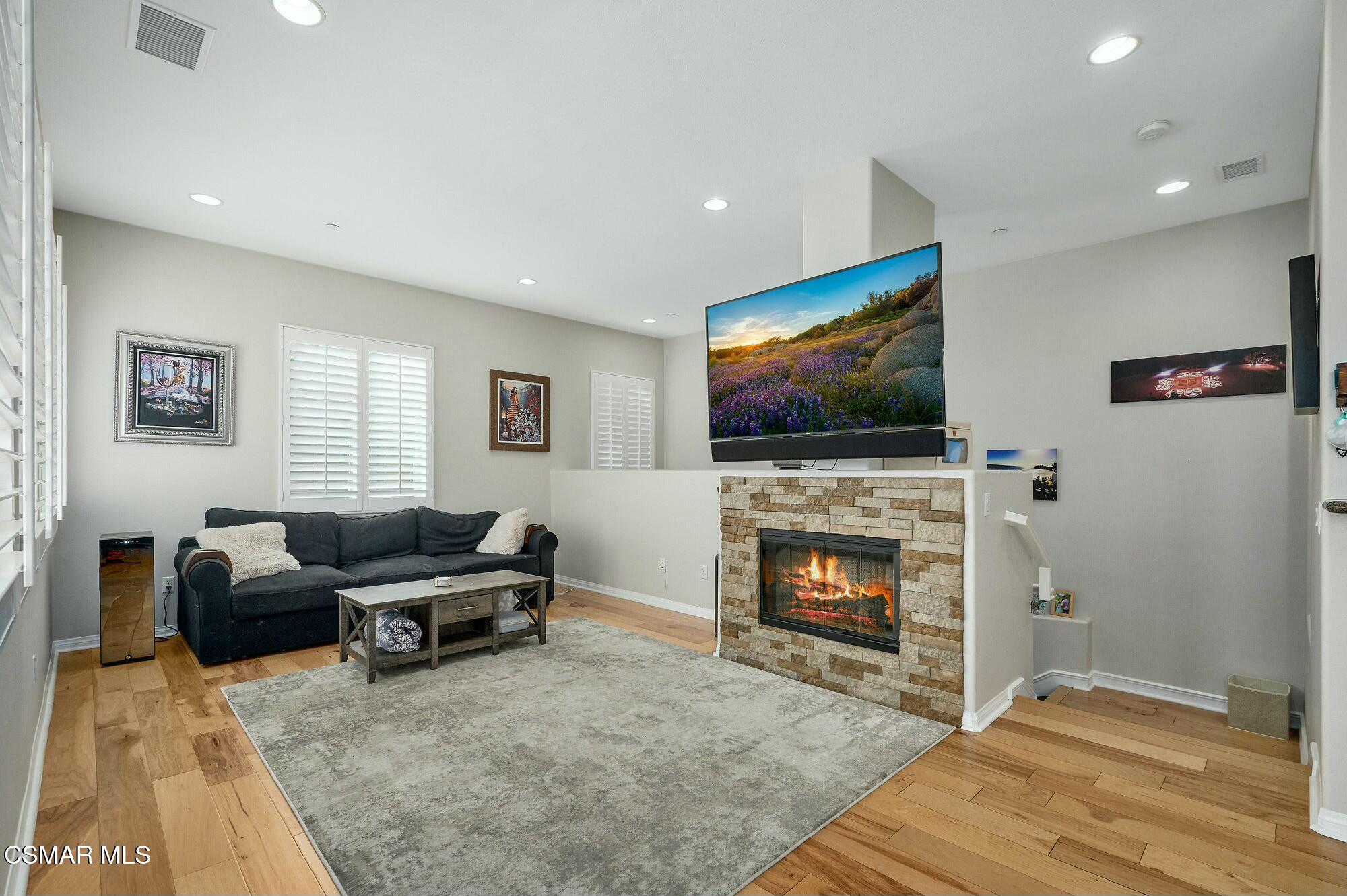 4121 Paredo Way, Unit D Simi Valley, CA 93063 - Photo 3 of 29 a living room with furniture flat screen tv and a fireplace