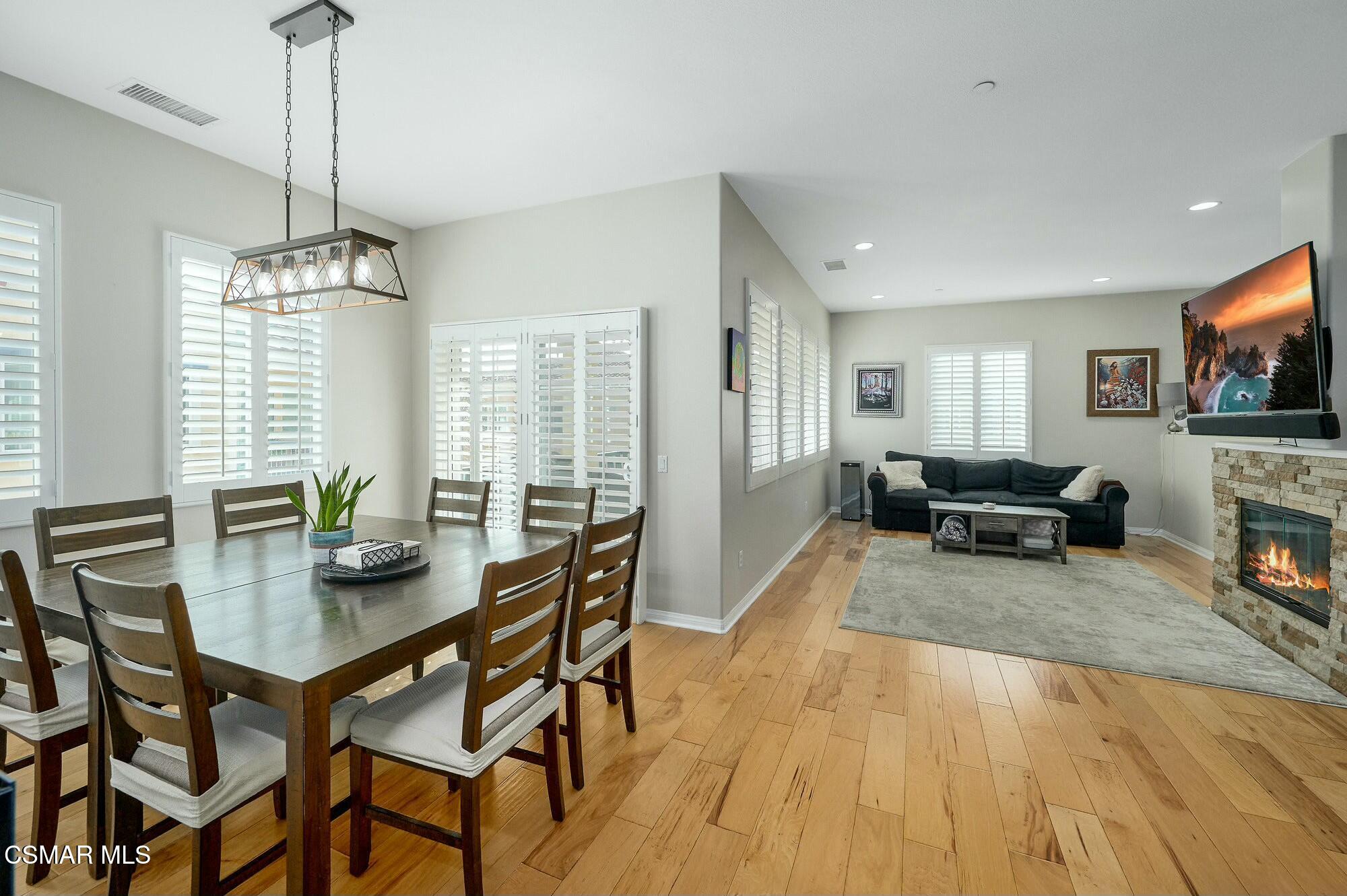 4121 Paredo Way, Unit D Simi Valley, CA 93063 - Photo 5 of 29 a view of a dining room with furniture window and wooden floor