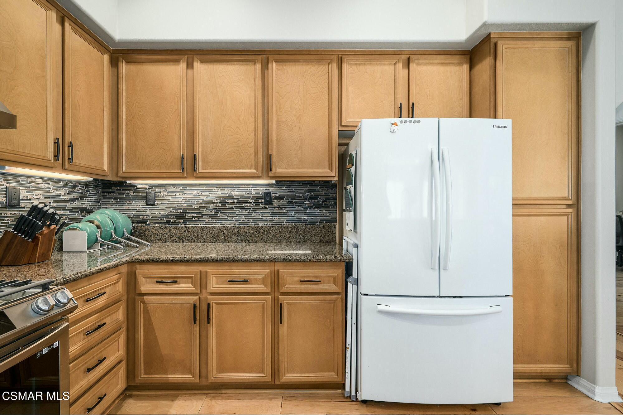 4121 Paredo Way, Unit D Simi Valley, CA 93063 - Photo 9 of 29 a white refrigerator freezer sitting in a kitchen