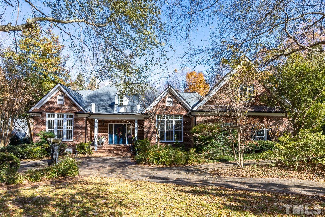 8712 Bell Grove Way Raleigh, NC 27615 - Photo 1 of 42 a front view of a house with garden