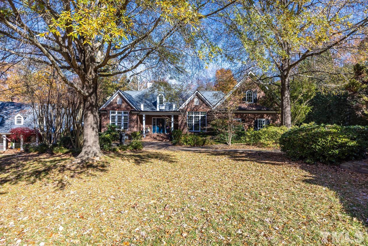 8712 Bell Grove Way Raleigh, NC 27615 - Photo 2 of 42 a view of a yard with plants and trees