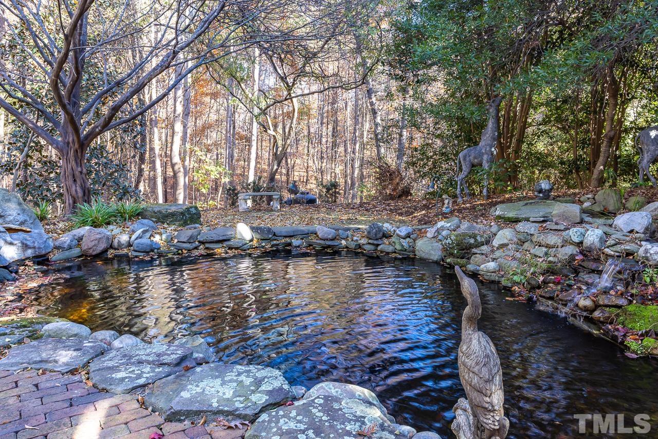 8712 Bell Grove Way Raleigh, NC 27615 - Photo 39 of 42 a large body of water with water fall