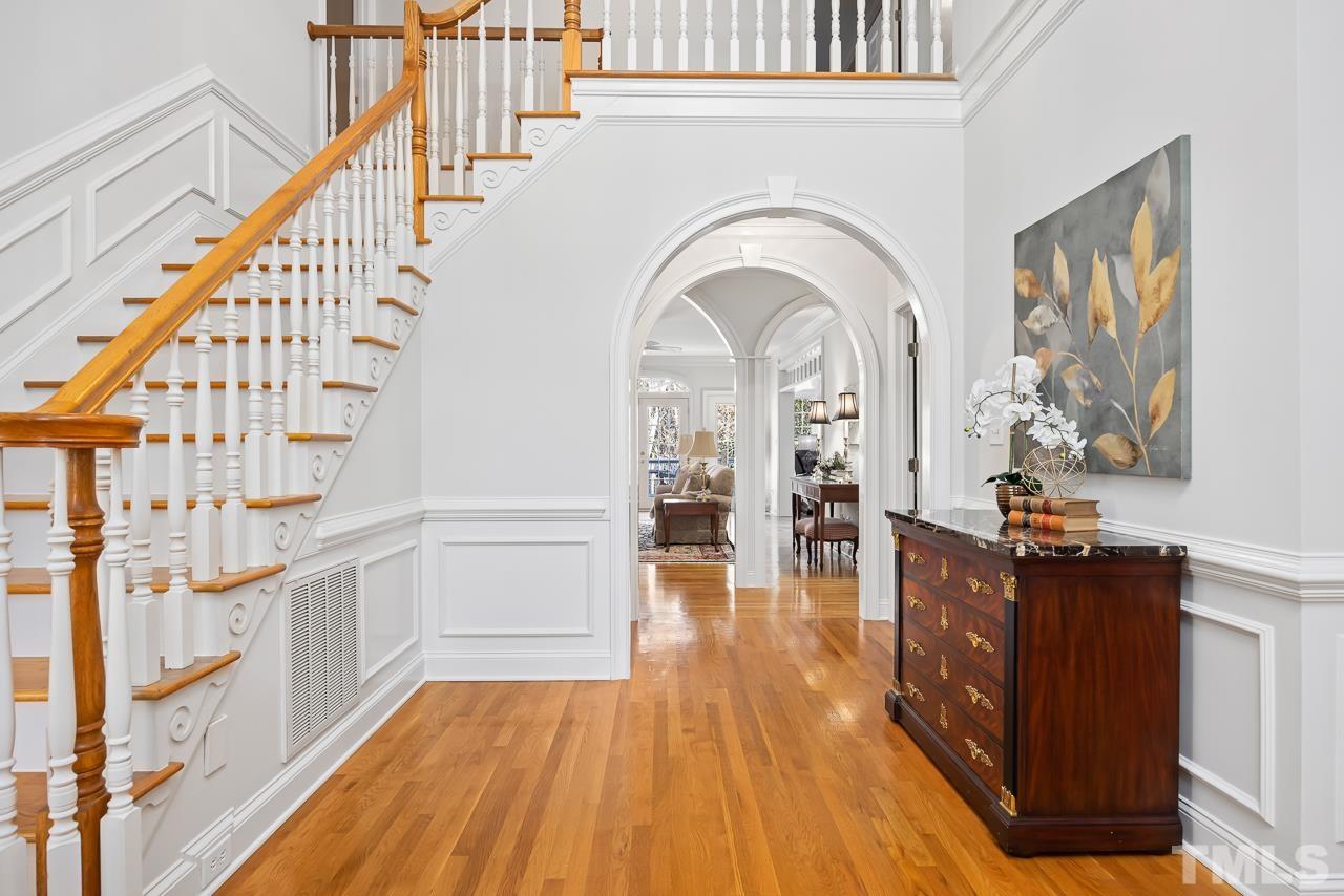 8712 Bell Grove Way Raleigh, NC 27615 - Photo 6 of 42 a view of entryway and hall with wooden floor