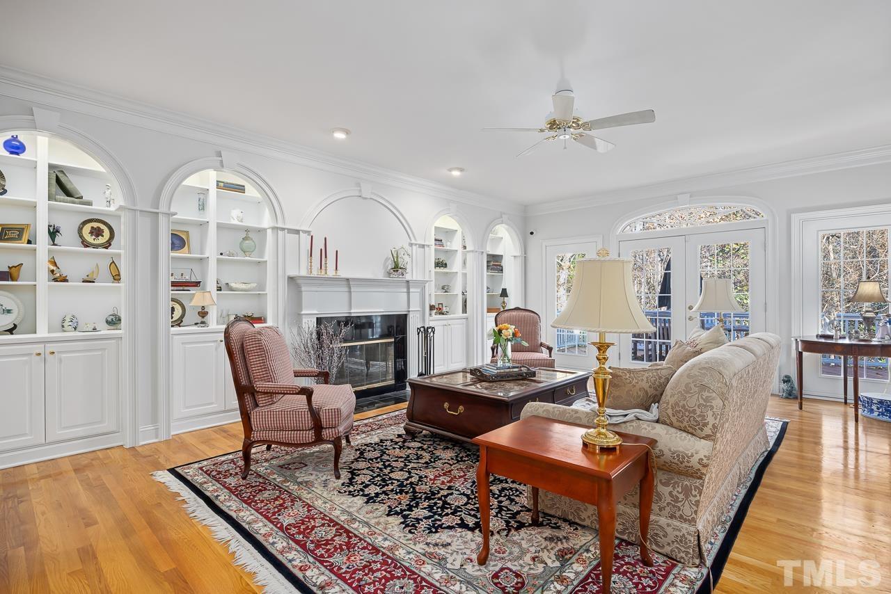 8712 Bell Grove Way Raleigh, NC 27615 - Photo 10 of 42 a living room with fireplace furniture and a rug