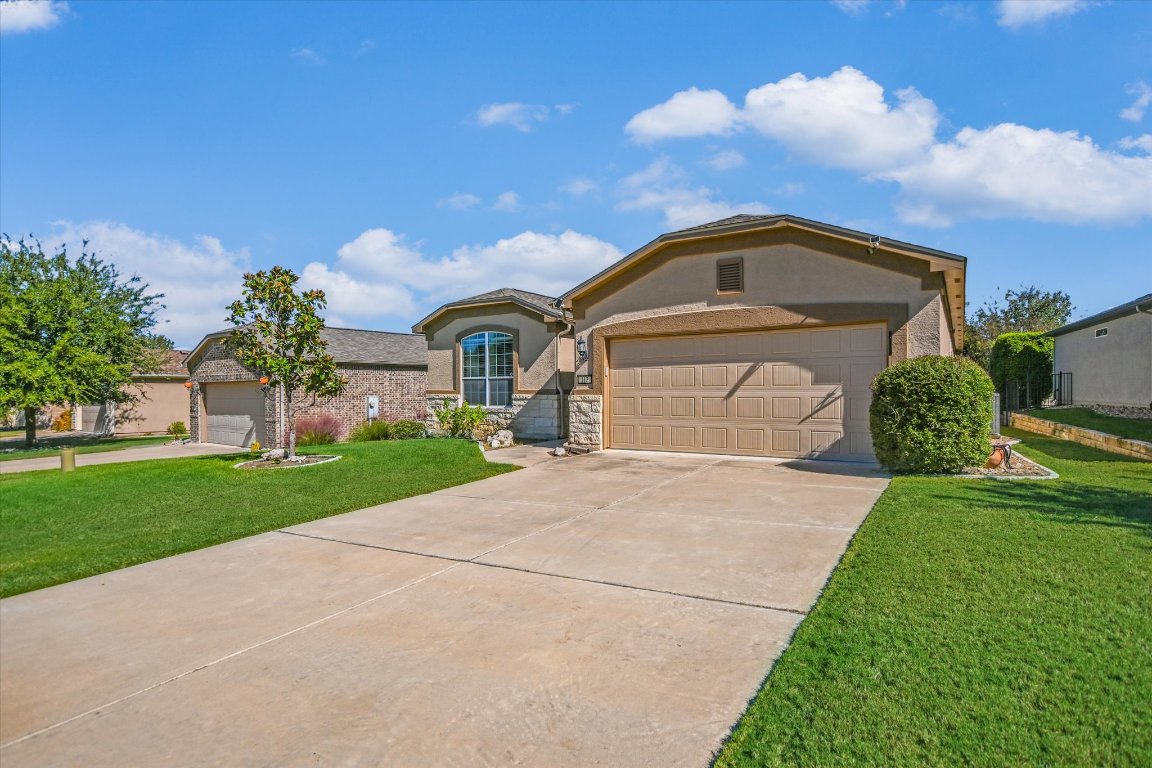 113 Cathedral Mountain Pass Georgetown, TX 78633 - Photo 2 of 29 a front view of a house with a yard
