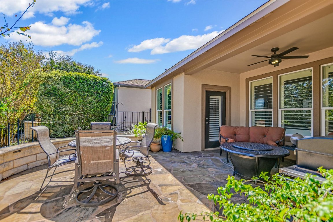 113 Cathedral Mountain Pass Georgetown, TX 78633 - Photo 24 of 29 a view of a patio with table and chairs and potted plants