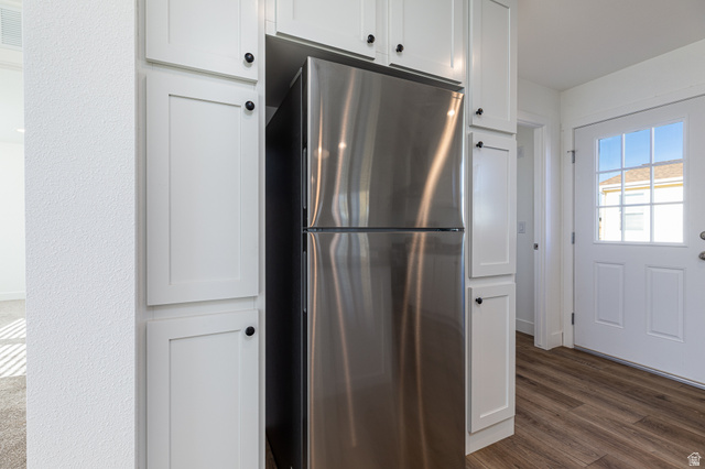 749 Riddle Drive Fredonia, AZ 86022 - Photo 5 of 41 Kitchen with freestanding refrigerator, white cabinets, and dark wood-type flooring