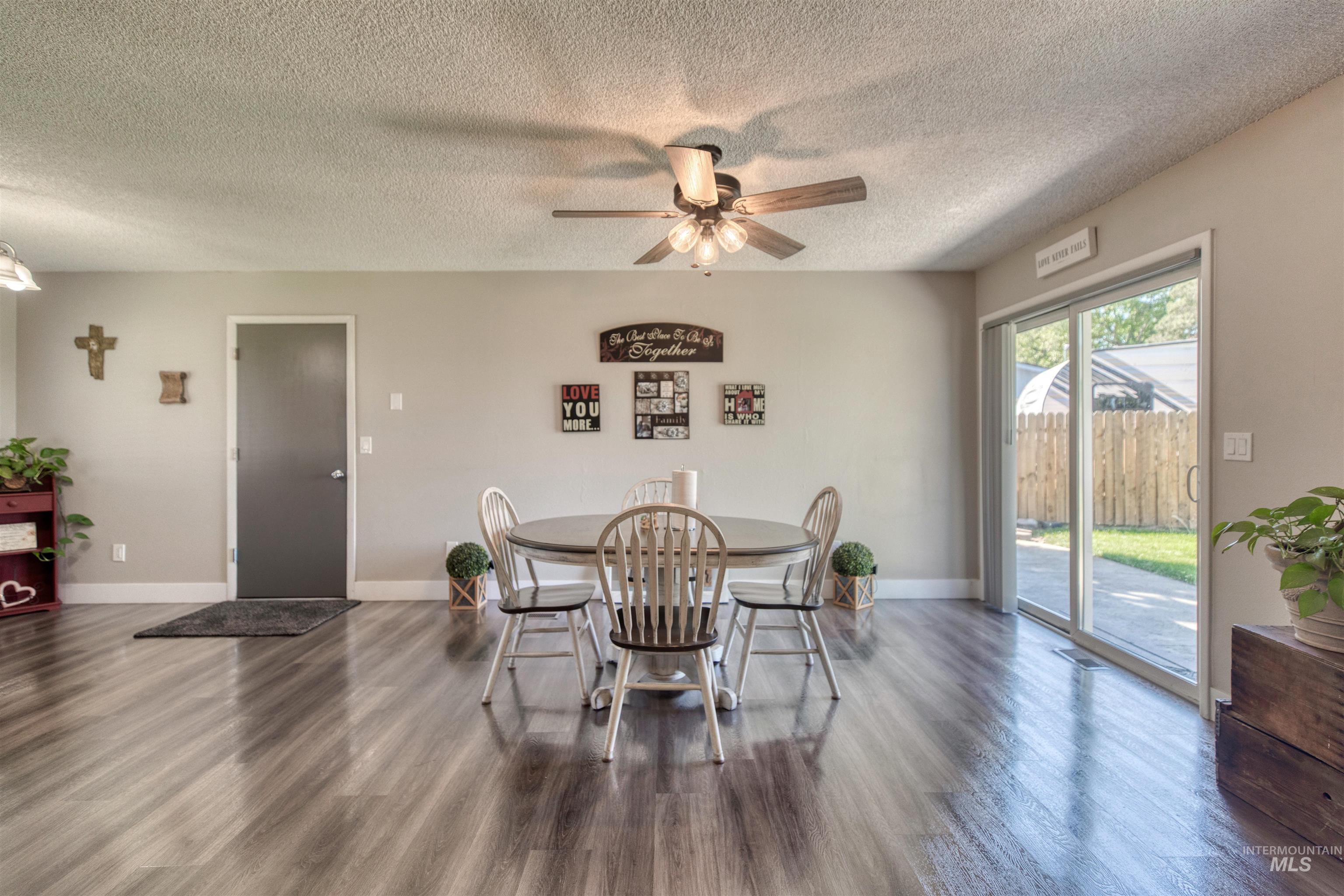 20803 Friends Road Greenleaf, ID 83626 - Photo 8 of 39 Spacious room featuring wood-finish flooring, a ceiling fan with integrated lighting, and neutral wall tones