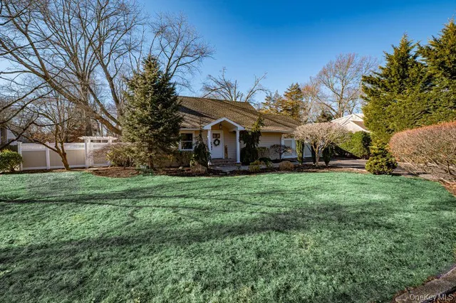 a bathroom with a shower sink and mirror