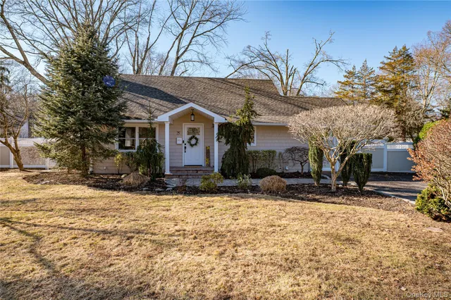 a bedroom with a bed and glass window
