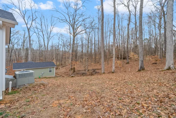 a fire hydrant in the middle of a yard