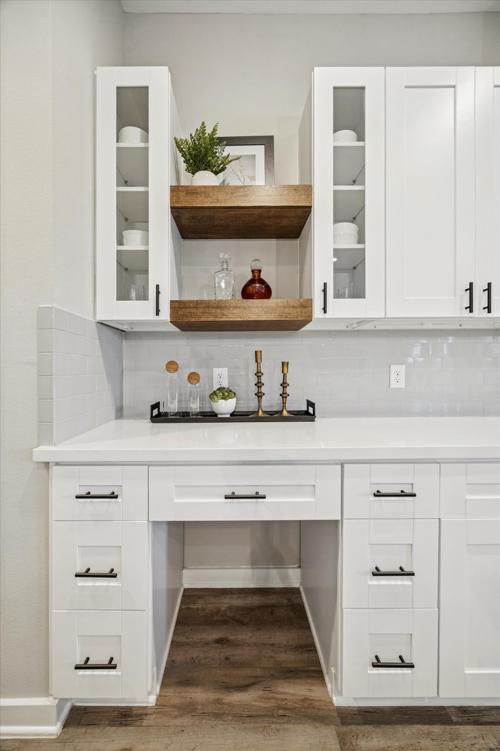 11327 Stonework Grove Lane Houston, TX 77076 - Photo 12 of 37 a living room with white cabinets and a wooden floor