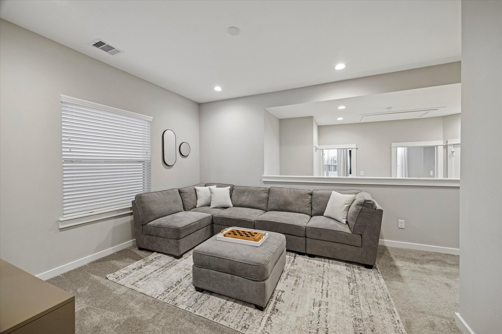 11327 Stonework Grove Lane Houston, TX 77076 - Photo 20 of 37 a living room with furniture and a window